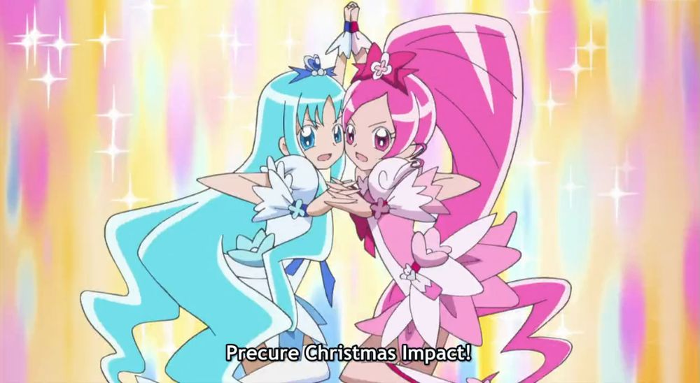 A screenshot from Heartcatch Precure of Cure Blossom and Cure Marine using an attack called "Precure Christmas Impact" that bears a resemblance to Domon and Rain's Erupting Burning Finger Sekiha Love-Love Tenkyouken attack from the end of G Gundam