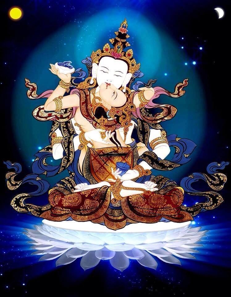 Image of Vajrasattva with consort sitting on a glowing white lotus and floating in space. There is a sun and moon above them. His right hand holds a vajra at the heart level and his left hand holds a bell at his hip.