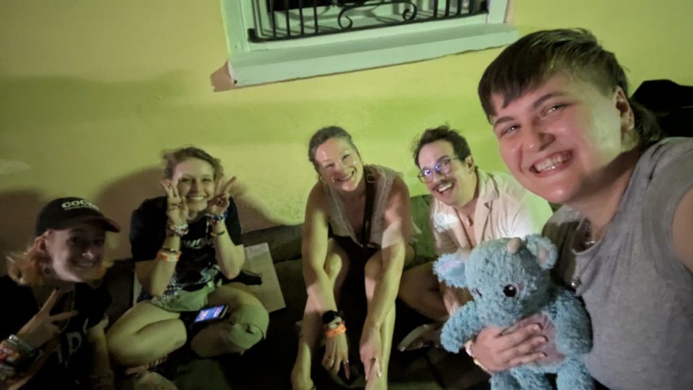 Joanna with four friends at the Joywave concert in Charleston. she is holding Trash, her special dragon stuffed animal