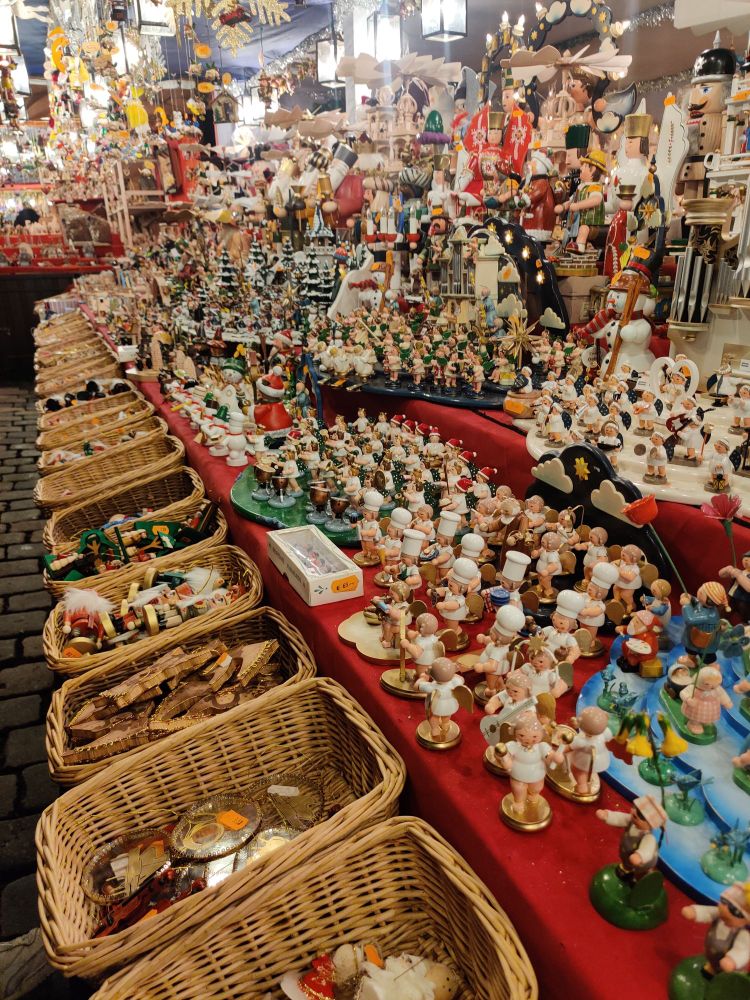 Display of wooden figurines at a stall