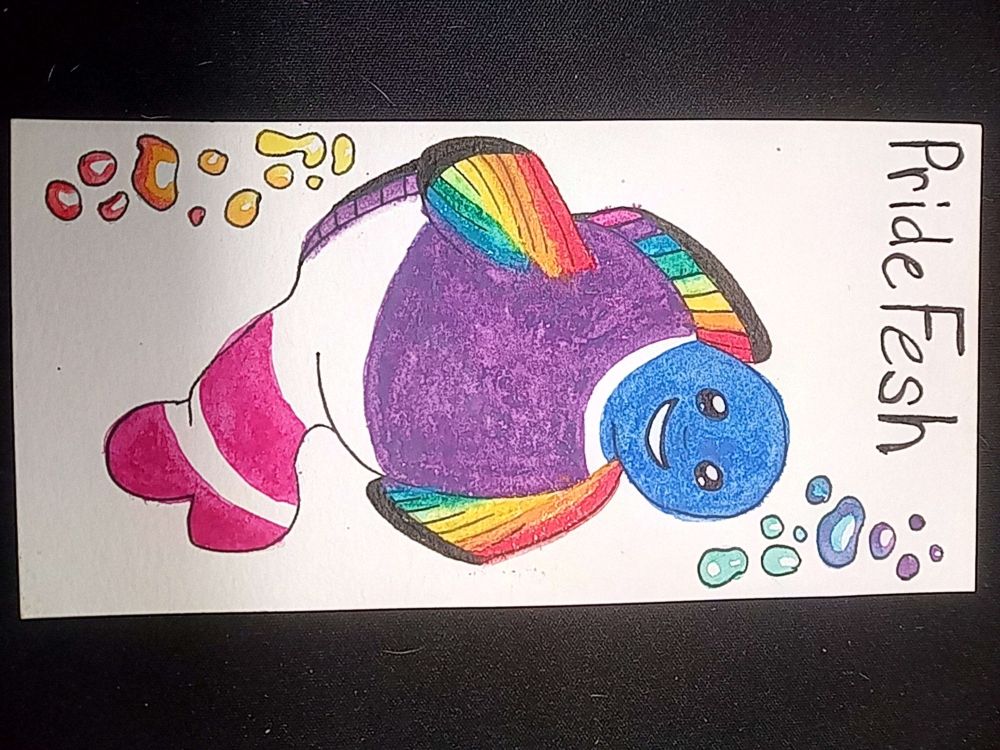 Title: Pride Fish
Picture of fish with smile face with rainbow bubbles. Body is in bi colors and fins are in rainow colors.
