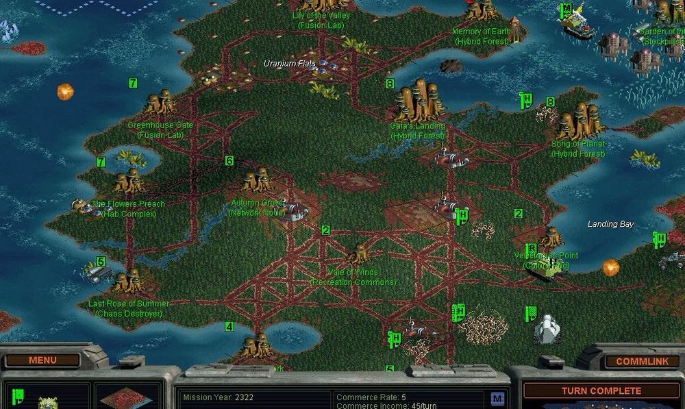 Screenshot from the game Sid Meier’s Alpha Centauri, showing an isometric map of a green continent surrounded by blue water and populated by cities linked by roads