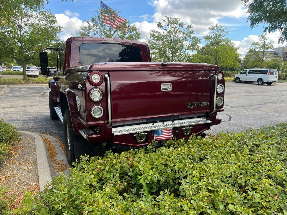 A burgundy red International MXT in a parking lot