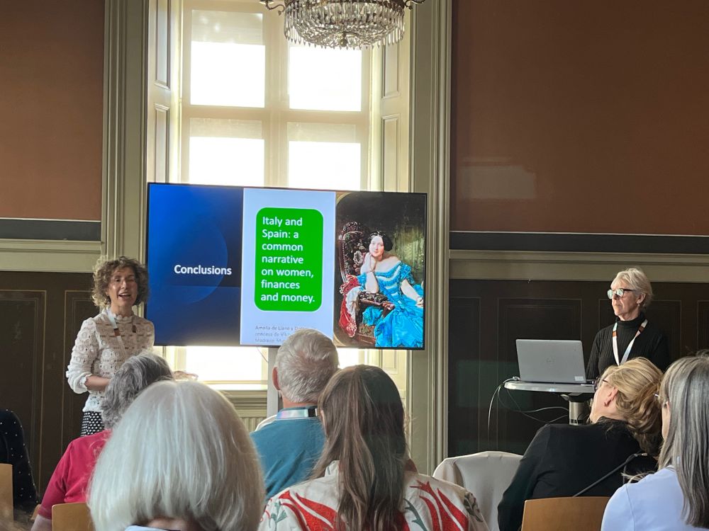 Slides from a joint presentation on women’s financial activities in Italy and Spain by Stefania Licini and Susana Martinez-Rodriguez, showing a colourful portrait of a wealthy nineteenth century woman.