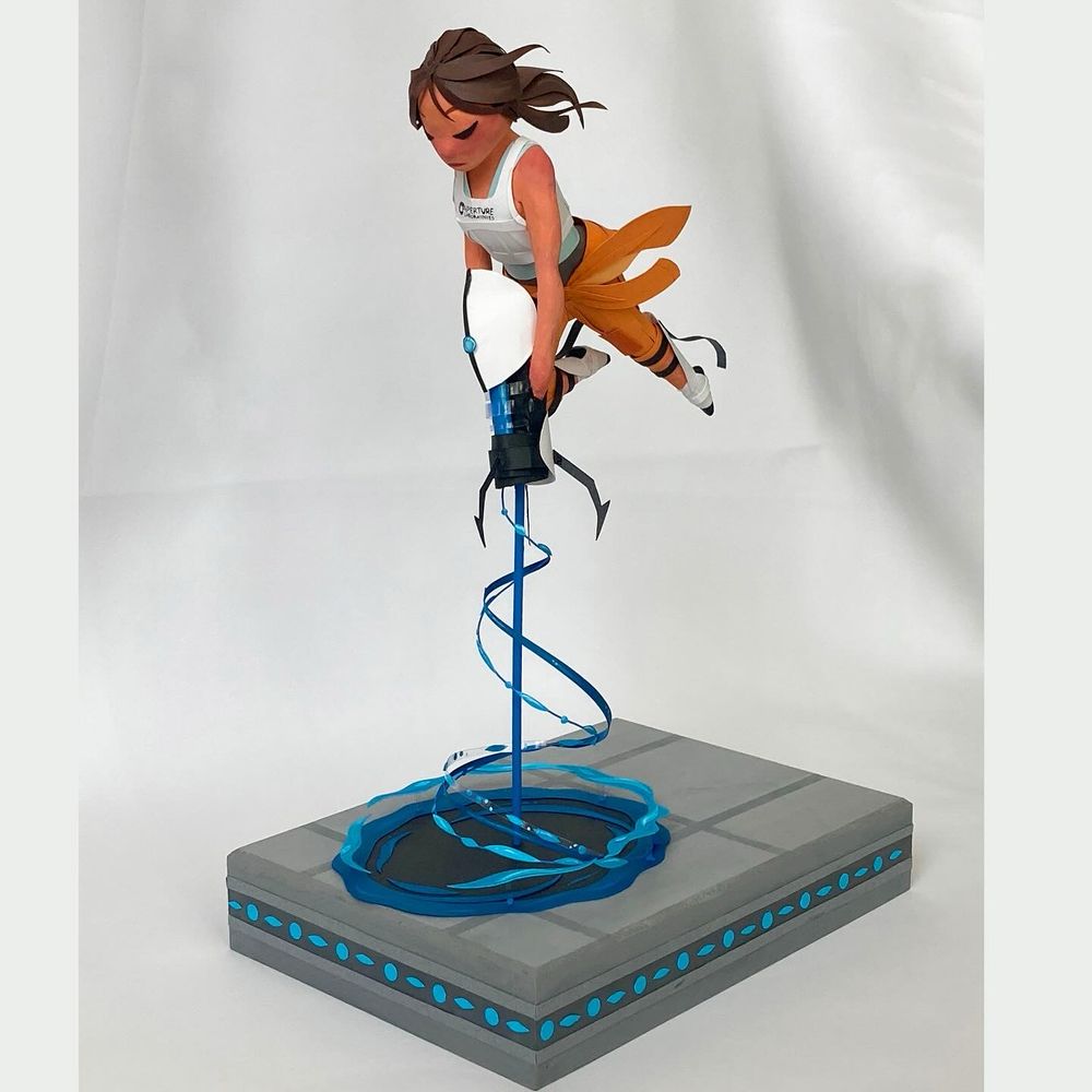 Chell figure shooting blue portal onto floor below her