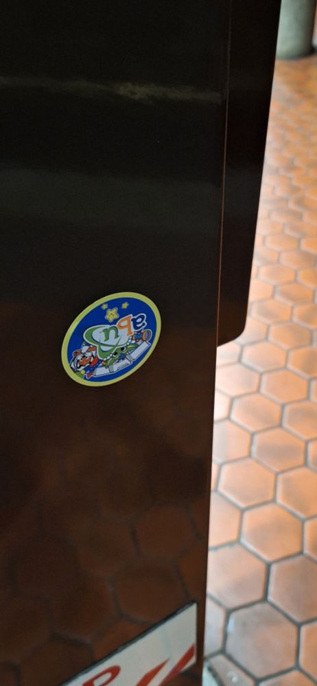 An ABU sticker on a pole in a subway station.