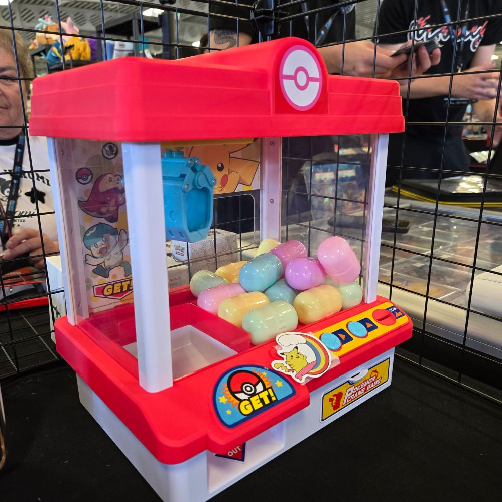 A pokemon themed mini crane game full of pastel mystery capsules for people to win