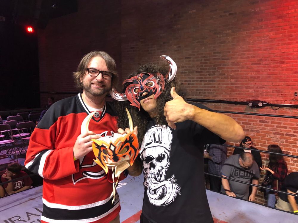 Me and Psicosis posing with the mask we bartered for 23 years earlier at a GCW show in 2018. 