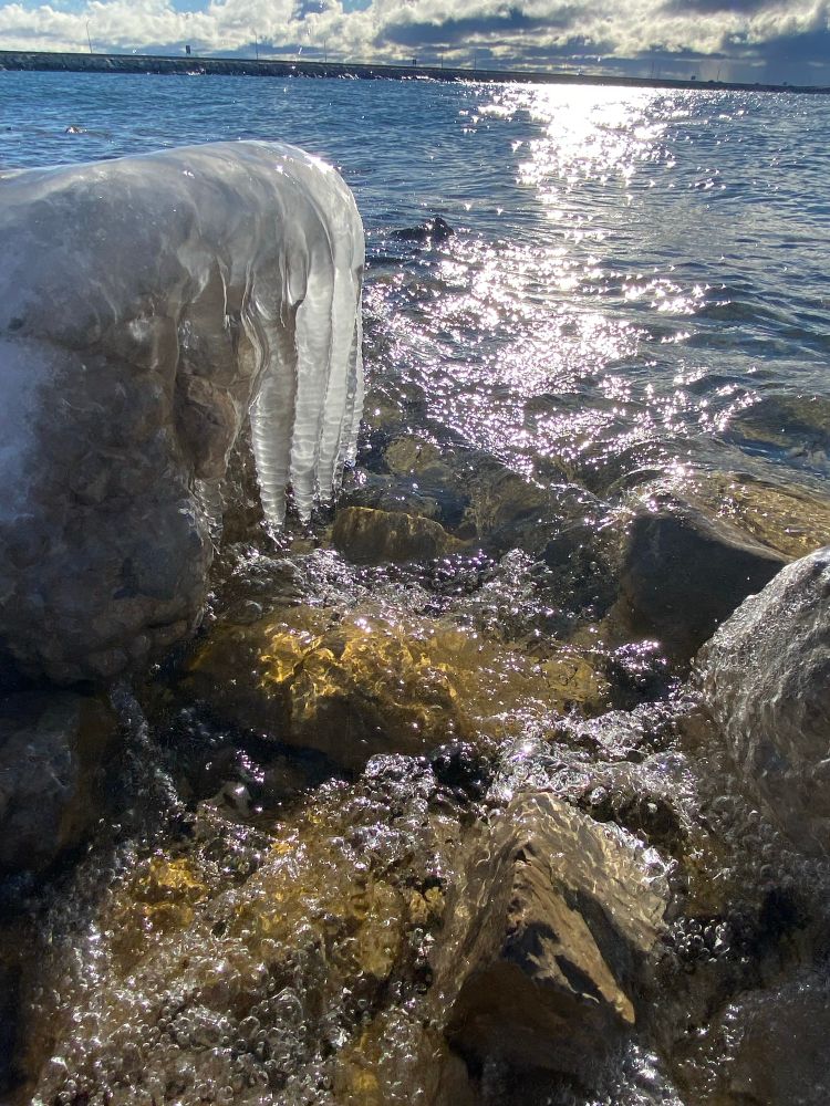 Ice covered rocks on the lakeshore 