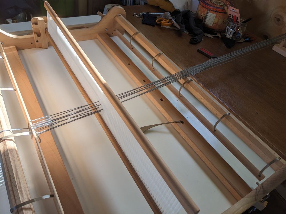 Starting the warp on the loom