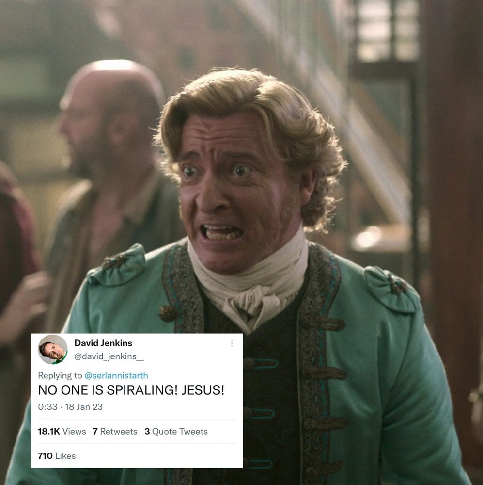 A screencap from OFMD s1e1; Stede looks frantic as he calls for the crew to go to their places for the "raid".

Someone has added a tweet from David Jenkins saying in all caps, "NO ONE IS SPIRALING! JESUS!"