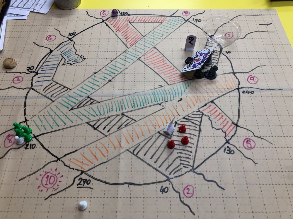 Top-down photo of the aftermath of the beholder battle, showing the crisscrossing bridges of the monster’s lair.