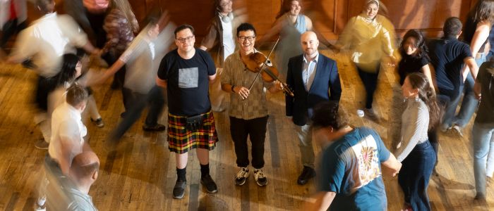 Pictured in central grouping surrounded by dancers, left to right: Dr Andrew Spencer, Institute for Gravitational Research, University of Glasgow; Lewis Hou, Founder and Director of Science Ceilidh; and Dr Christopher Berry, Institute for Gravitational Research, University of Glasgow. Photo credit: Chris James
