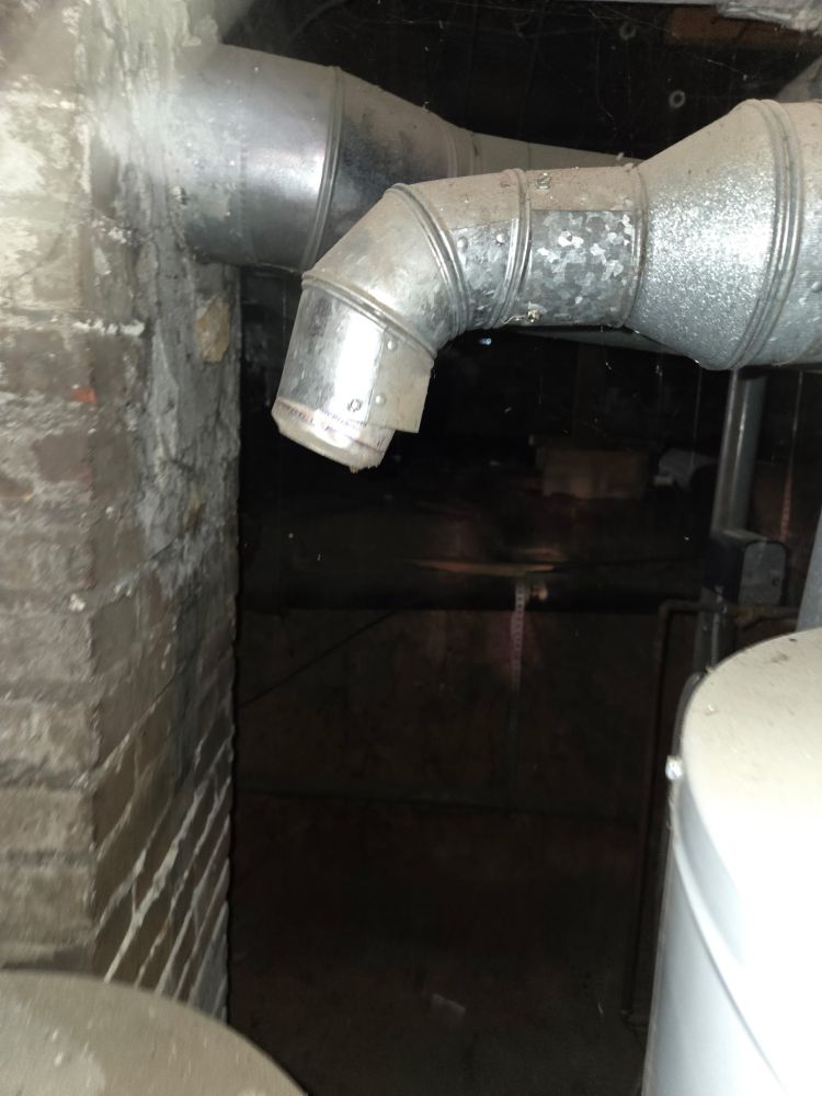 Water heater exhaust not properly installed with a beer can as a cap