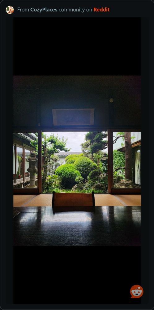 An interior shot looking out onto a very manicured garden within a courtyard 