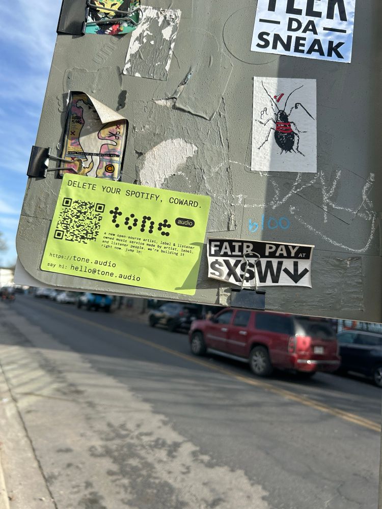 tone.audio promotional sticker, placed on a sign