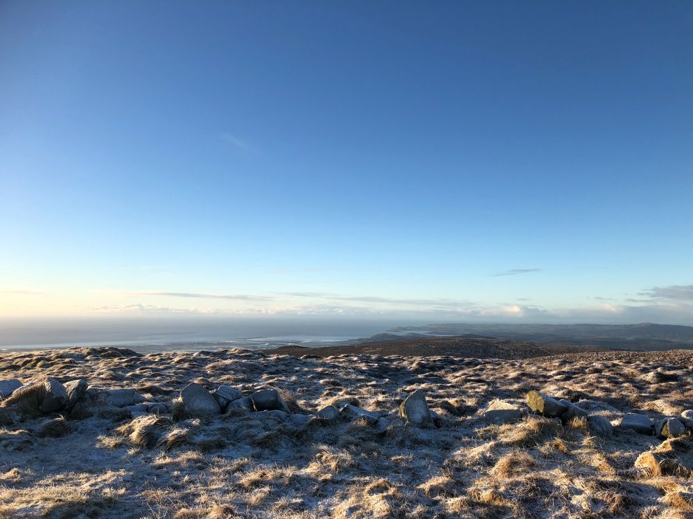 Looking up the coastline of the Solway Firth from the frosty summit of Criffel