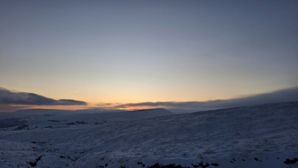 Sunrise over a Marsden Moor snowscape