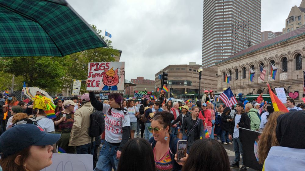 Boston Pride with anti-ICE and No Kings protest signs