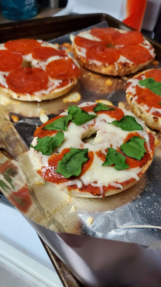 Asiago bagels with pizza sauce, mozzarella, and pepperoni/Spinach