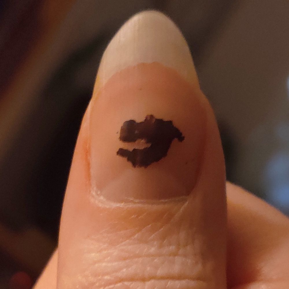 my chipped purple nail polish in a familiar shape...