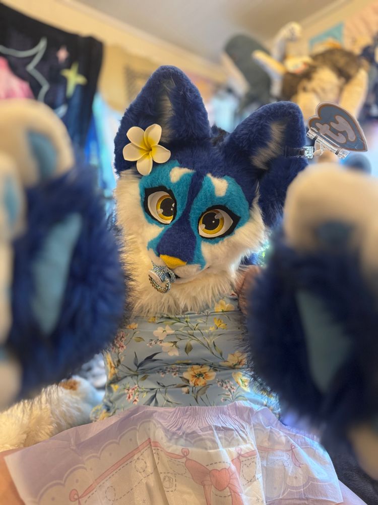 Katyja with outstretched arms and a diaper between her legs