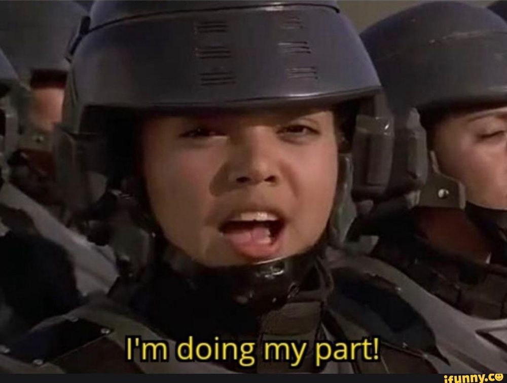 A screenshot of Starship Troopers with a trooper looking at the camera and saying "I'm doing my part!"