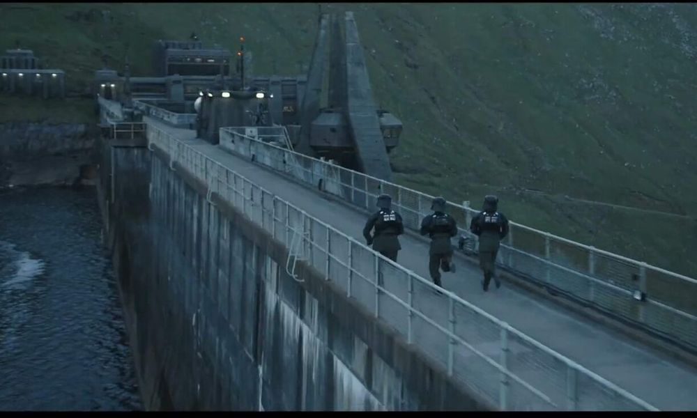 Empire garrison troops run across the Nasma Klein river dam in Andor season one. Actually the Cruachan Dam near Oban in Scotland.