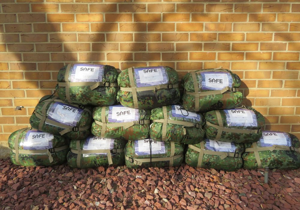 12 sleeping bags stacked up