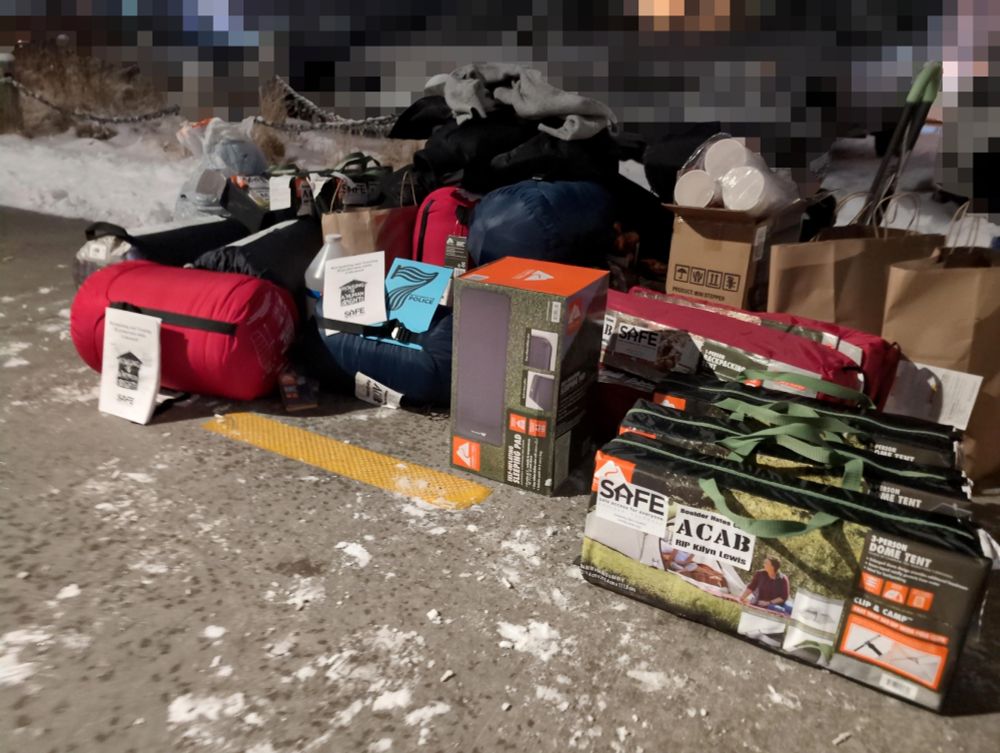 Tents, sleeping bags, and other survival gear and some zines.