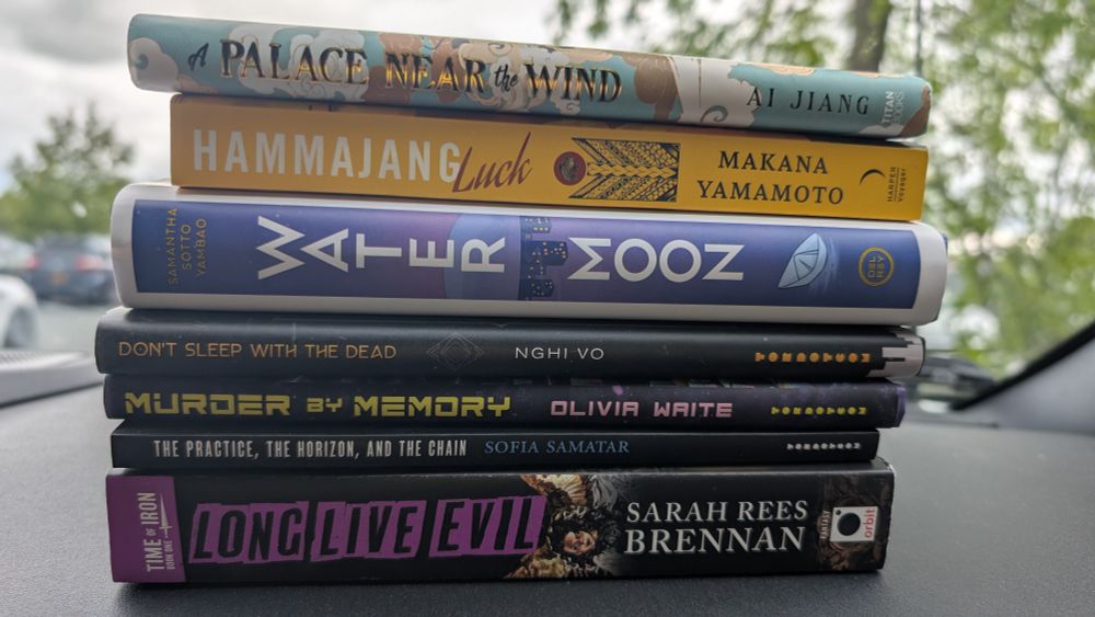 Stack of books top to bottom, a palace near the wind Ai Jiang, Hamajang luck makana Yamamoto, water moon Samantha Sotto yambao, don't sleep with the dead nghi vo, Murder by memory, Olivia Waite, the practice, The horizon, and the chain. Sophia samatar, long live evil. Sarah Rees Brennan