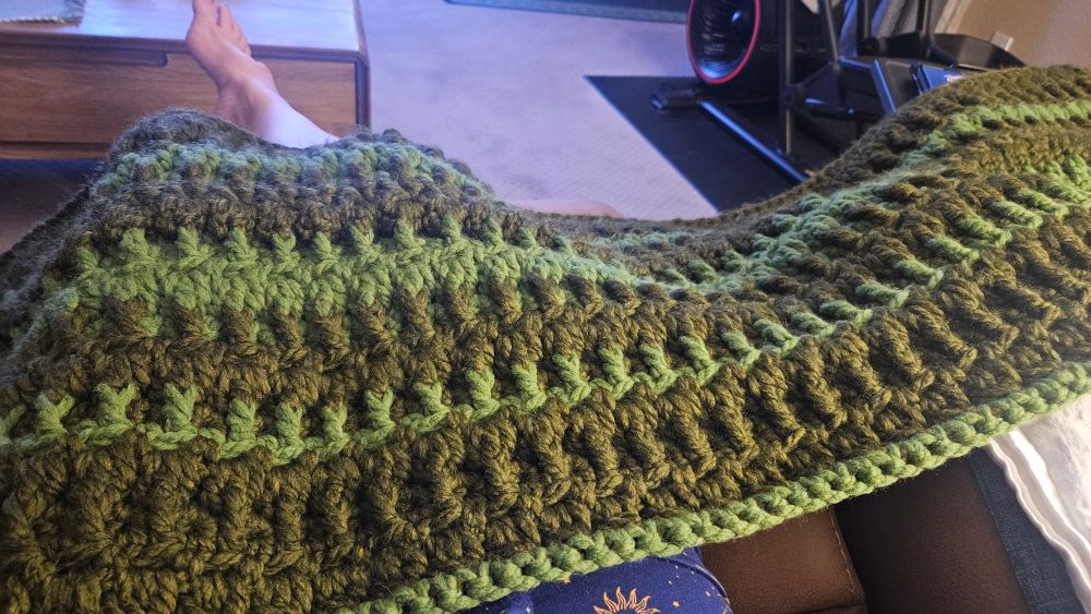 Working on crocheting a throw blanket. I'm using a heavier wool yarn with a dense stitch & a four row repeat.  