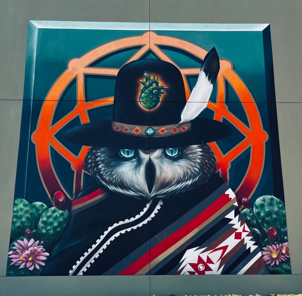 Picture of a street art, an owl with a hat