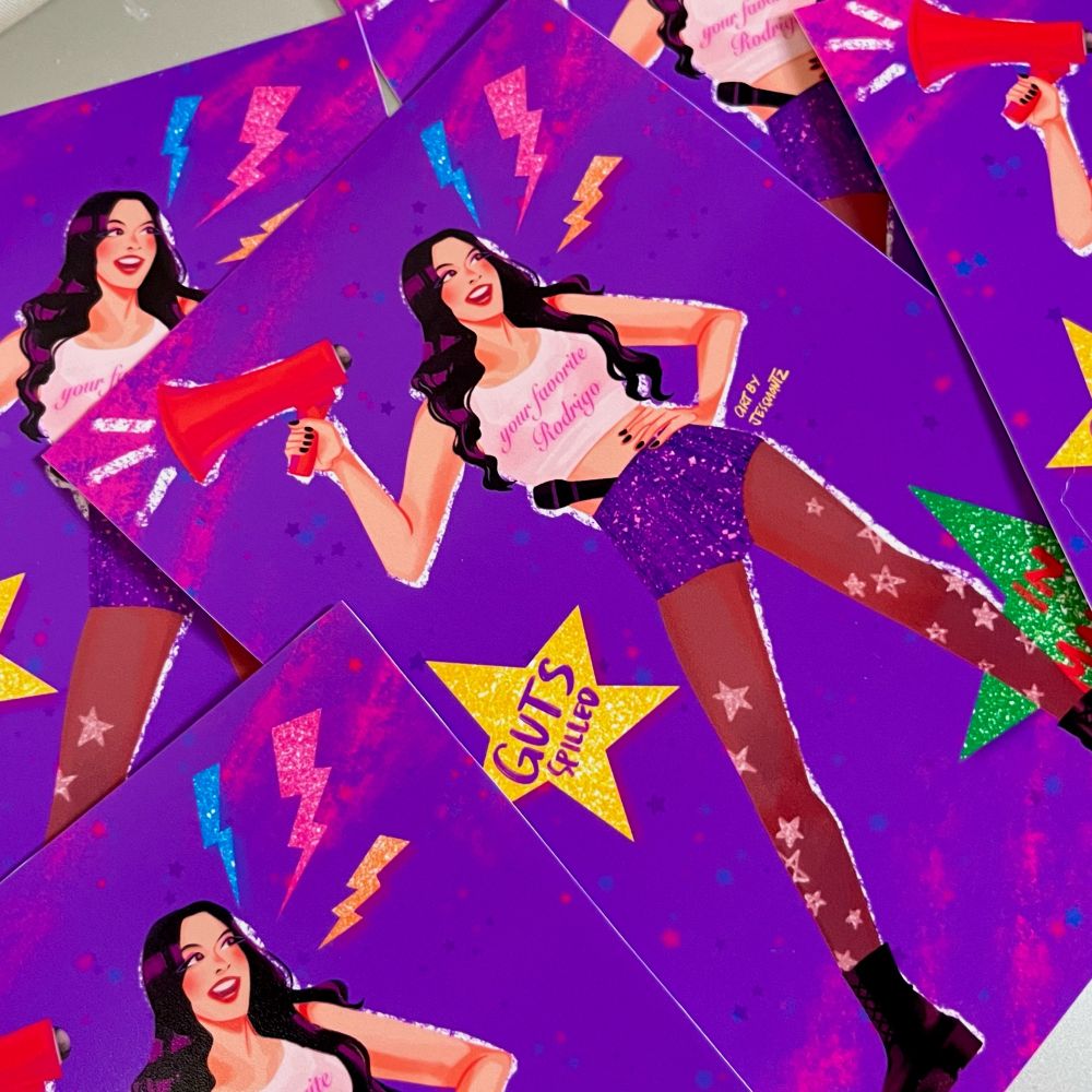 Olivia Rodrigo holding a megaphone