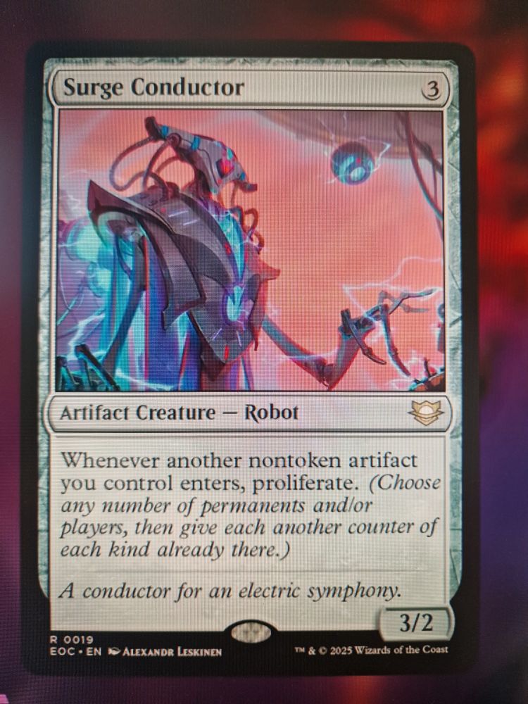 Magic card titled Surge Conductor 
It has an illustration of a shiny robot with lots of sparks. Text:
Whenever another non token artifact you control enters, proliferate