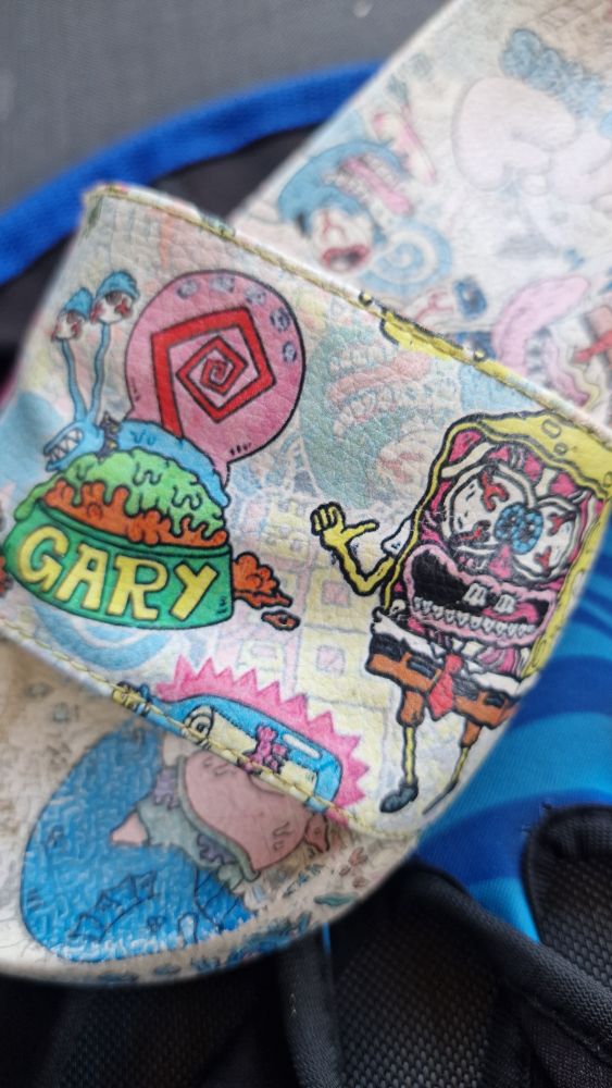 Children 's slipper with gruesome picture of Spongebob with his face peeled off