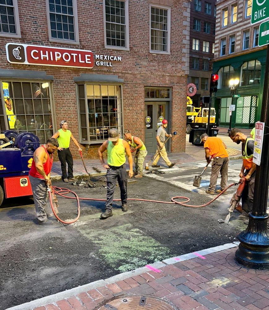 Boston Public Works Department crews raising castings on School Street