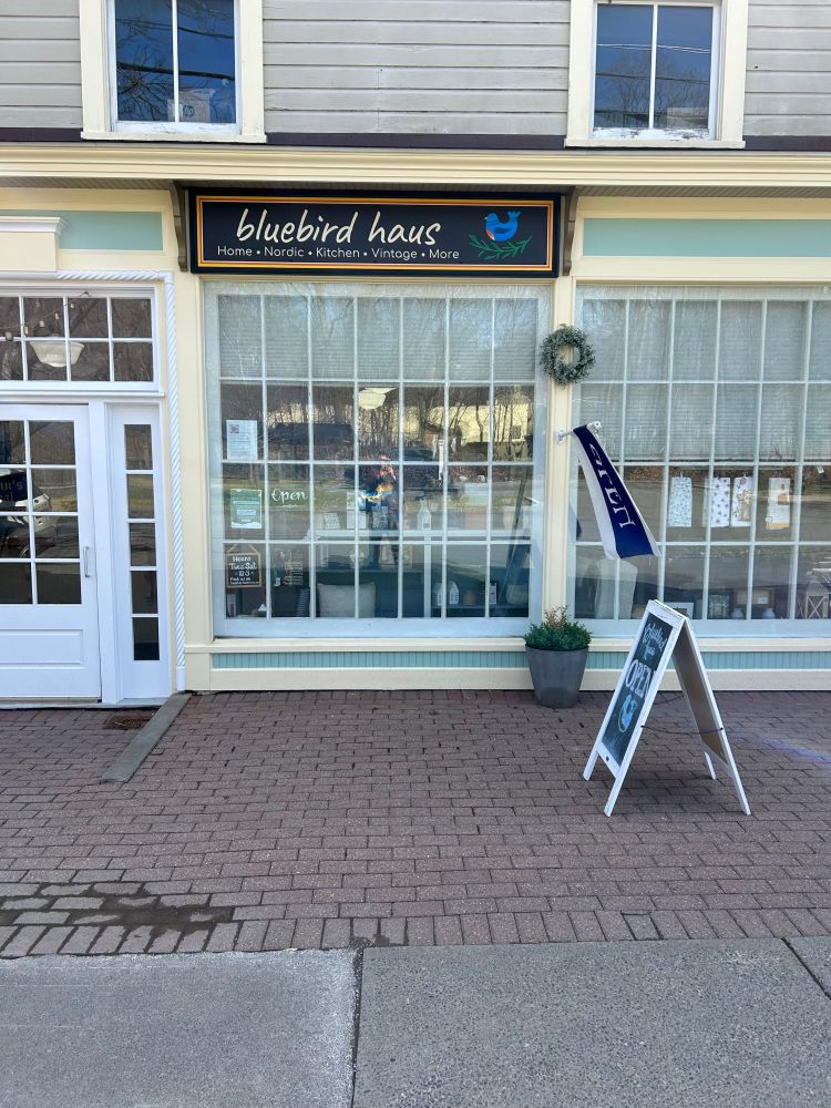 Photo of Bluebird Haus in Cooperstown, NY. Sign sub-heading reads: “Home*Nordic*Kitchen*Vintage*More”