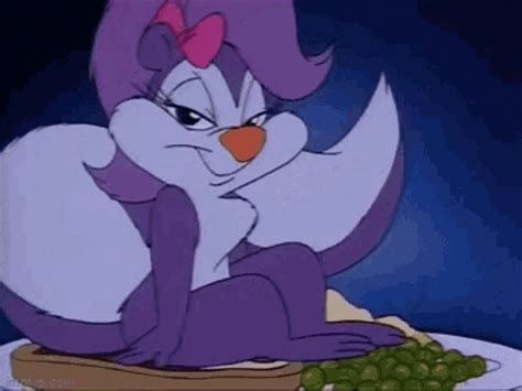 Fifi sitting seductively. ...Her tail is dangerously close to those mashed potatoes (Tiny Toon Adventures, 1990)