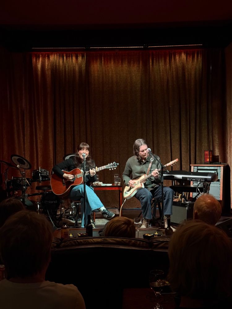 Cassidy Mann and Kris Ulrich playing together in an intimate home venue.