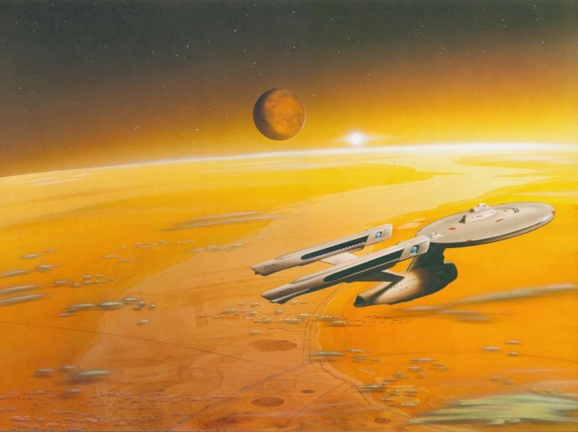 The USS Enterprise, a spaceship from Star Trek, flies over an orange and yellow planet with a brown moon in the background.