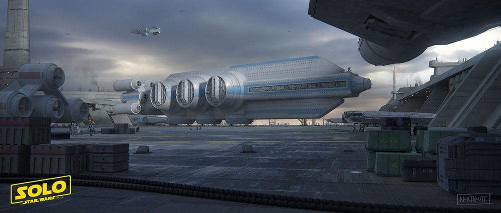The image depicts a bustling, industrial spaceport under a grey, overcast sky. The central focus is a large, sleek passenger transport ship, painted white with blue accents, resting on a wet, reflective tarmac.

In the foreground, stacks of cargo crates are arranged on the landing platform. Other ships, including a portion of one on the left and the underside of another framing the top-right, along with various spaceport structures, fill out the scene, creating a sense of a busy, functional environment. The overall mood is cool, atmospheric, and cinematic.