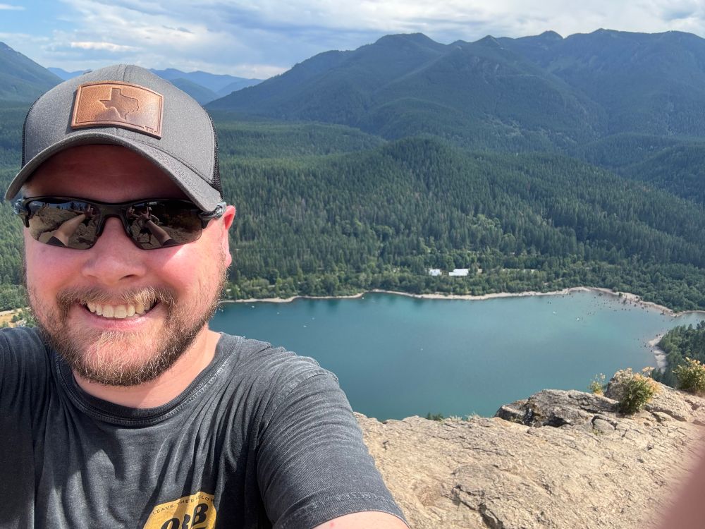 picture of me at the top of the rattlesnake ledge trail. the lake is in the background 