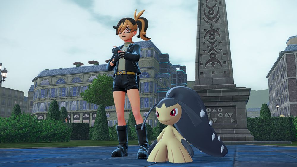 In game screenshot of Zoé standing beside Marie in one of the plazas in Lumiose City