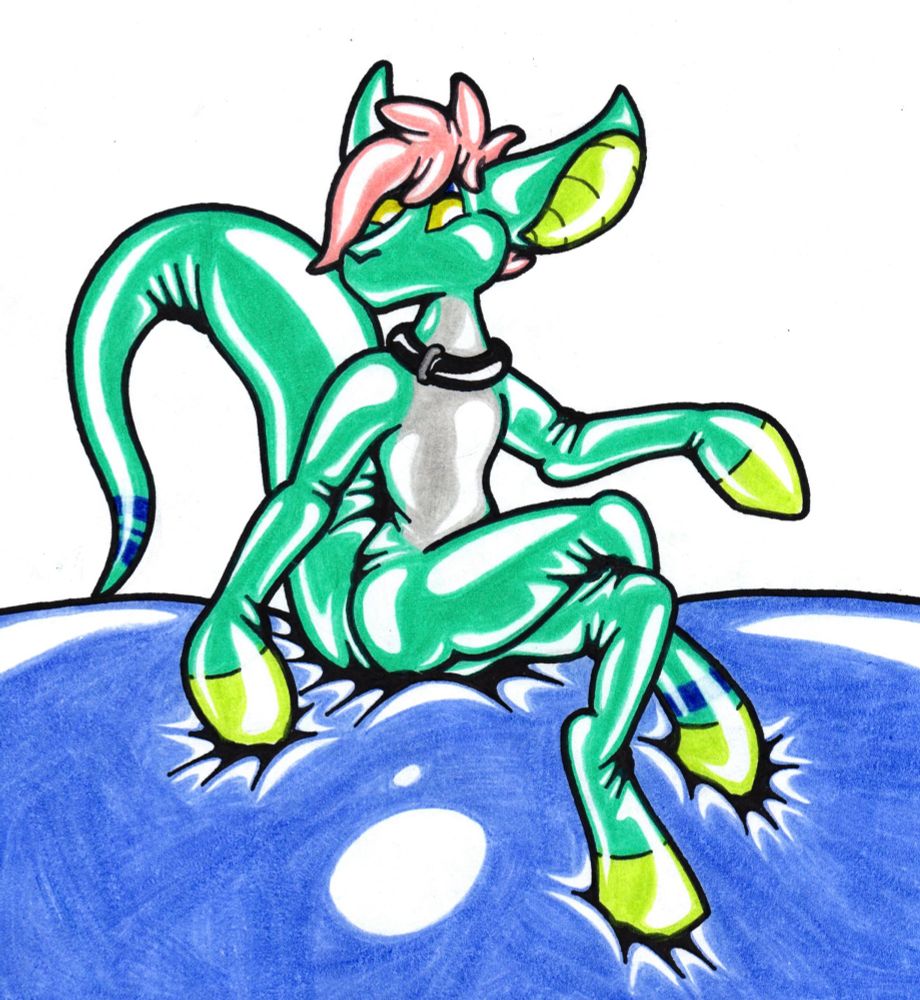 Koay, an aqua green and gray rubber yinglet, sitting on a squishy latex surface. They have short orange hair, blue stripes on the tail and one ankle, a black collar, lime green smooth hooves, and a smooth muzzle with no mouth visible.