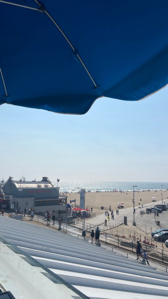 Santa Monica pier from rooftop bar, beach is in the distance. 
