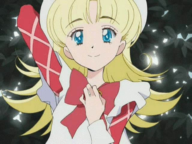 a girl with blonde hair and blue eyes is wearing a red and white outfit with a bow