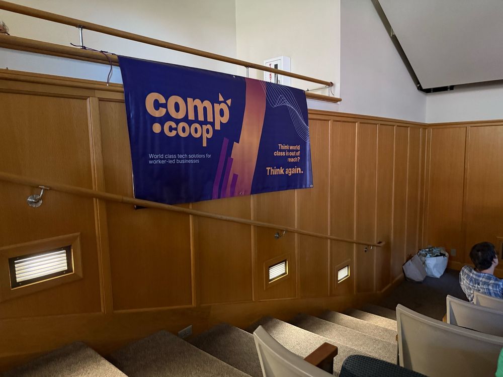 comp.coop's banner hanging in the lecture hall.