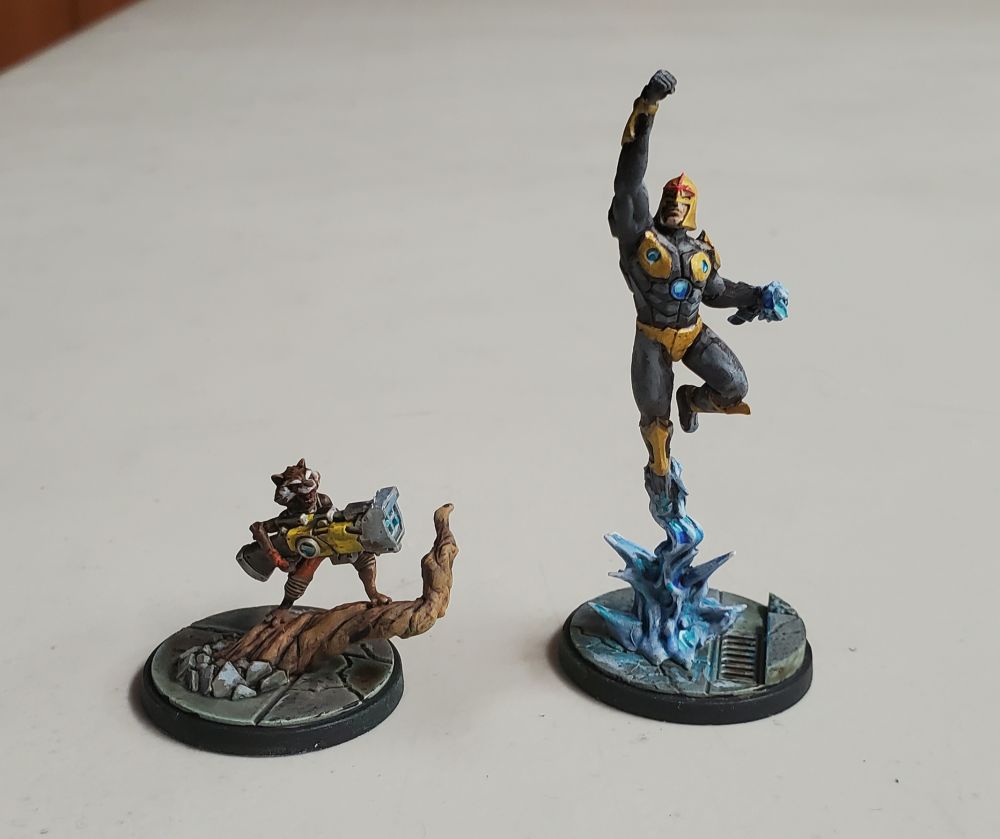 Two minis from Marvel Crisis Protocol, Rocket and Nova.