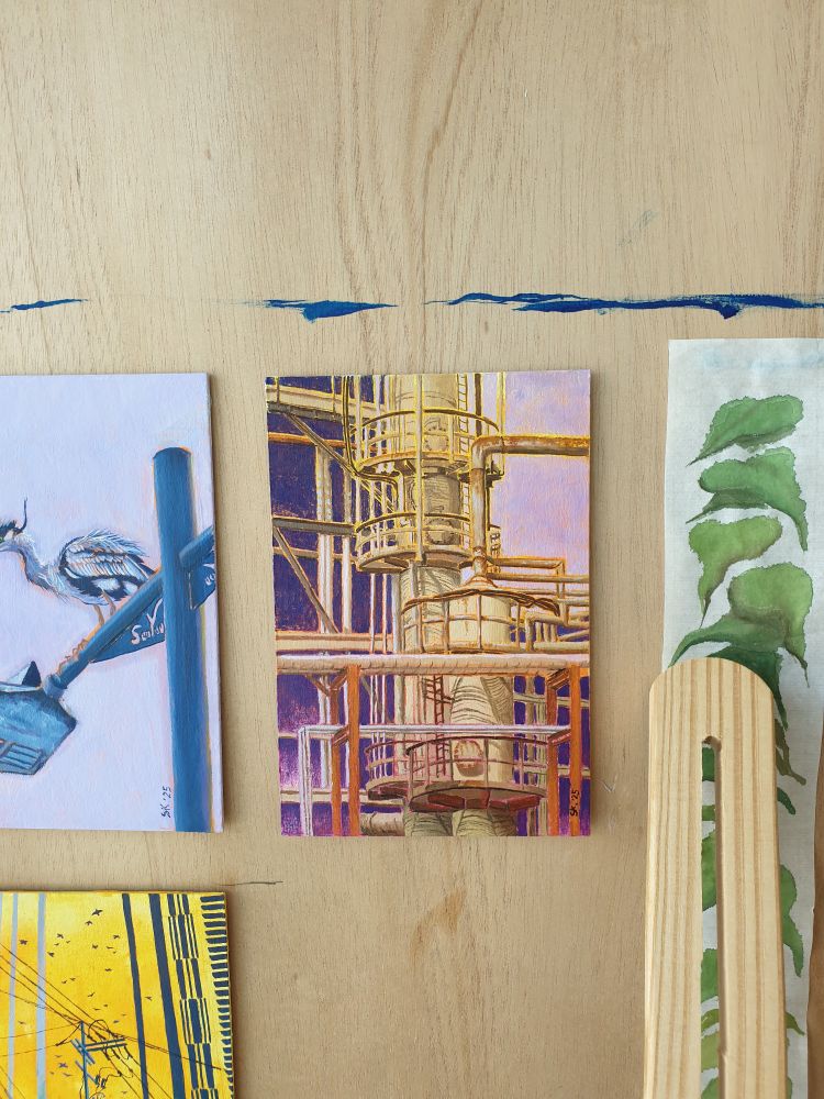 A small oil painting of an industrial factory.